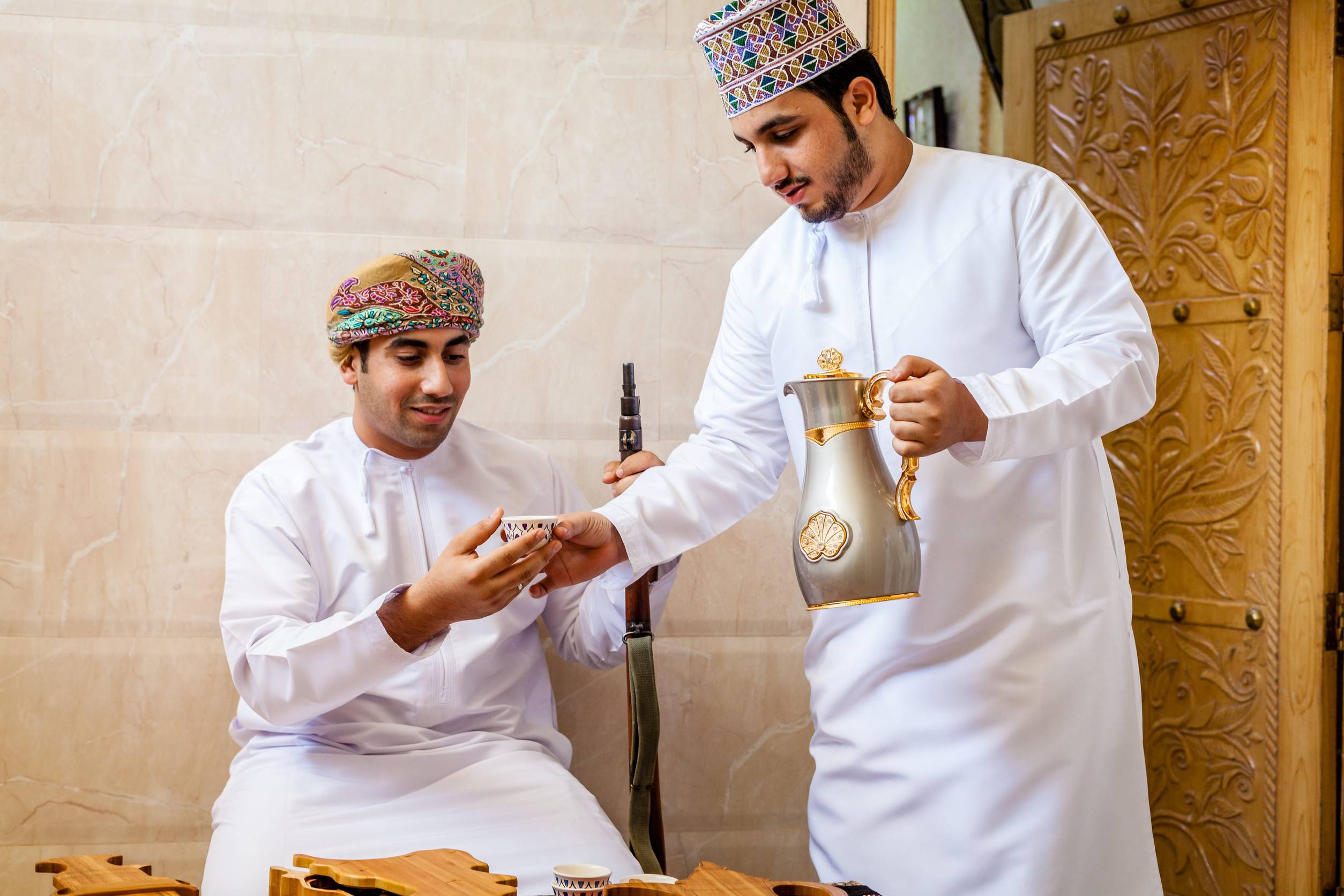 2 Omani Men Having Traditional Omani Coffee
