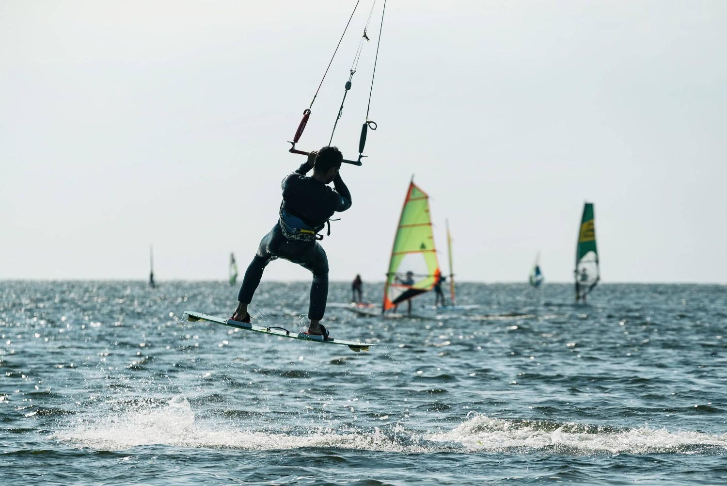 Kitesurfer Performing Jump Over The Sea